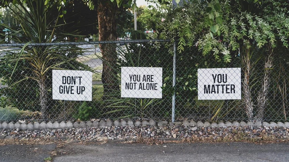 don't give up. You are not alone, you matter signage on metal fence