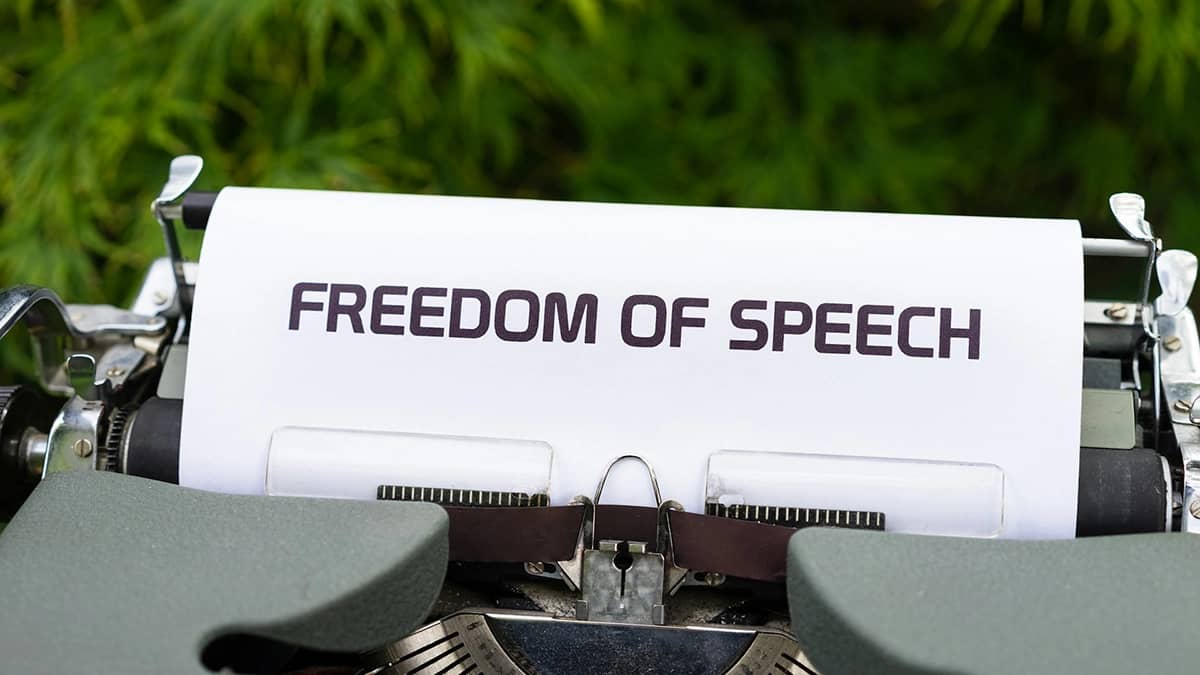 Image of a typewriter with a paper displaying "Freedom of Speech"