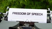 Image of a typewriter with a paper displaying "Freedom of Speech"