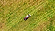 white and black truck on green grass field during daytime